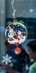 Christmas colored stickers on glass close-up