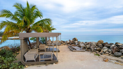 Tropical Island beach resort, with palm trees and beach chairs