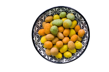 Nuts in bowls on the table, almonds, cashews and coasted nuts on the blue background.