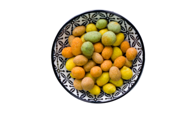 Nuts in bowls on the table, almonds, cashews and coasted nuts on the blue background.