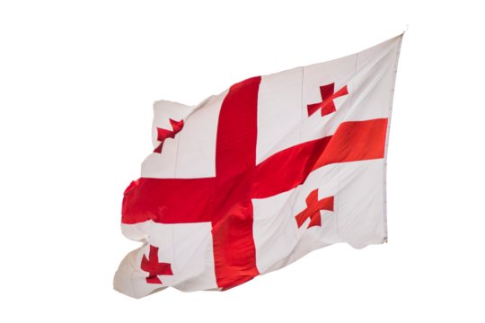 Georgian flag in wind on the sky background.