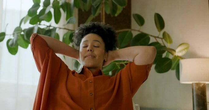 Young Adult Black Woman at Home Relaxing, Mediating with Eyes closed