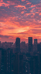 Fototapeta premium a vibrant sunset over the city skyline, with purple and orange hues lighting up the sky, silhouetting modern buildings and creating a tranquil evening atmosphere.