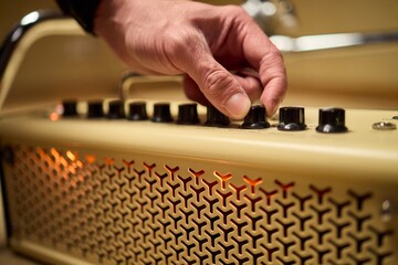 A musician is adjusting the amplifier settings for optimal sound quality during a performance