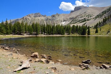 picturesque  wheeler peak, pyramid peak, and jeff davis peak on a sunny  summer day across stella lake  along the alpine lakes loop trail in great basin national park near baker, nevada