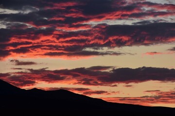 dramatic sunset  in summer over the mountain peaks  of great basin national park, from baker, nevada