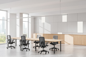 Fototapeta premium Modern office interior with desks, ergonomic chairs, and large windows overlooking cityscape. Bright, minimalistic design. 3D Rendering