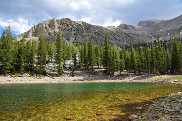 picturesque  wheeler peak and jeff davis peak on a stormy  summer day across teresa lake  along the...