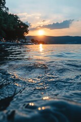 Sunset serenity, Background of blurred tranquil coastal scene Gentle waves on a beach at dusk.