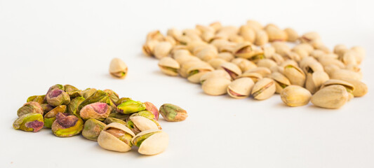 Roasted pistachios on white background