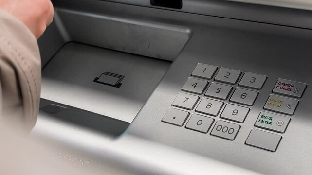 Close up of withdraw money on a cash machine, russian atm