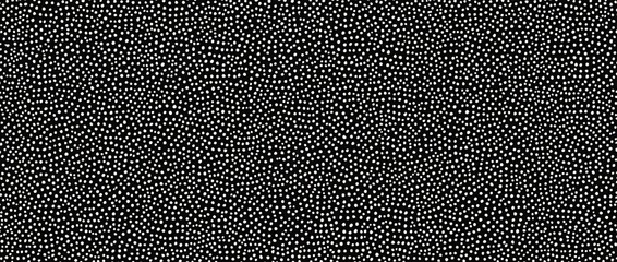 Seamless small dense polkadot  spots pattern in white on black background. Abstract dot cellular texture.