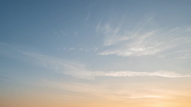 Beautiful 4K Timelapse of beautiful sunset sky with pastel blue and orange and wispy clouds