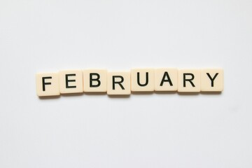 February written  with scrabble tiles