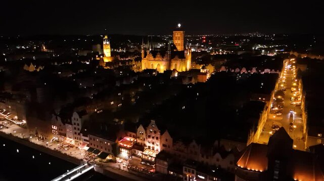 View from the drone on the old town of Gdansk on the Moltawa River at night