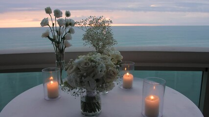 Decor for a romantic candlelit dinner overlooking the sea