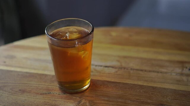 Two glasses of Ocha tea are served on the restaurant table and ready to drink.