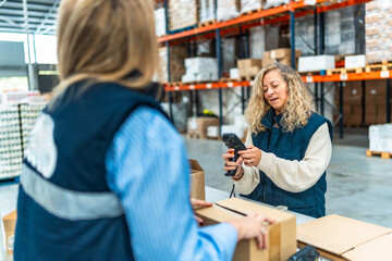 Distribution warehouse workers preparing parcels to deliver