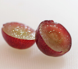 Red grape cut in half close up