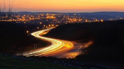 Fototapeta premium Stunning Night Highway Winding Through City Lights