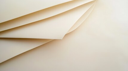 Various sheets of off-white paper are neatly arranged in a layered formation, creating an interesting composition of texture and shadows with soft lighting highlighting the curves