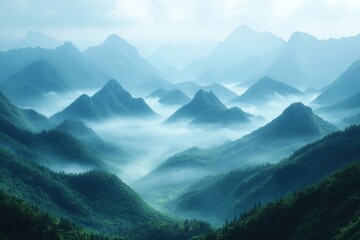 Misty mountain landscape with layered peaks and low clouds during dawn in a serene atmosphere