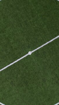 DRONE AERIAL FOOTAGE - Aerial view of a Sports field in a residential area with artificial green grass and football goal in Santo Tirso, Portugal. Soccer pitch.