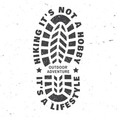 Hiking it's not a hobby it's a lifestyle. Vector illustration. Extreme adventure. Hiking related typographic quote. Concept for shirt or logo, print, stamp. Design with hiking boot print, footprint