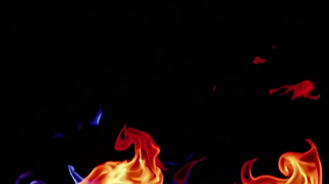 Dancing flames create mesmerizing patterns of light and color in a darkened setting