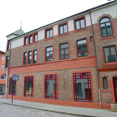 Obraz premium Building in Alesund city on a summer day, Norway. View of colorful Art Nouveau architecture port