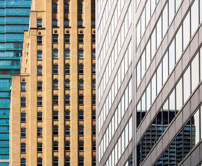 Fototapeta premium A close-up view of a cluster of tall buildings in a city. 