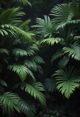 Dense cluster of green palm leaves on a dark background in a lush tropical jungle garden, exotic, tropical