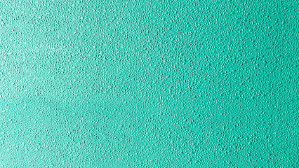 Textured teal surface with fine grain detail, ideal for use as a background, design inspiration, or texture overlay in graphic and interior design projects.