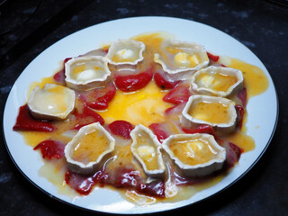 Baked Goat Cheese with Roasted Piquillo Peppers on White Plate, Gourmet Appetizer Dish