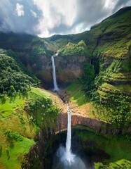 Generated image Aerial perspective of Tad Fane Waterfall plunging into a deep gorge in the Bolaven Plateau