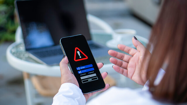 Emergency warning alert alarm on Smartphone, Data network protection, mobile cybersecurity or a password to confirm login in the online banking application. security technology digital information.