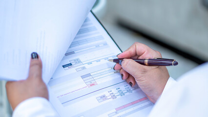 Business woman calculating expenses, managing budget, papers, loan documents, invoices. count taxes rental tenancy sum to pay online. businesswoman check company finances and earnings and budget.