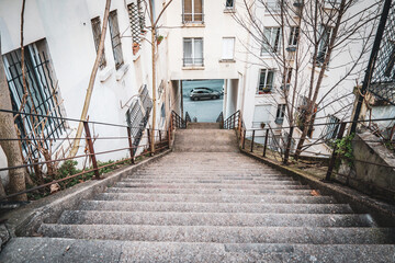 Steps leading down to a quiet street in a residential area
