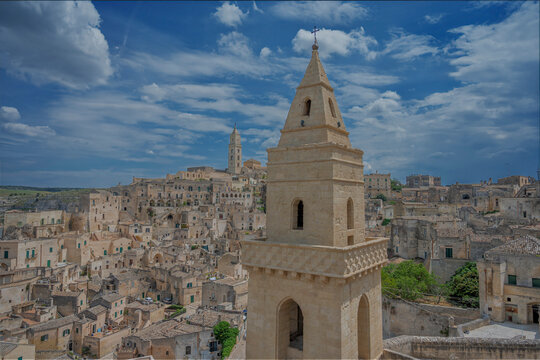Experience the Breathtaking View of Materas Majestic Ancient Architecture Beneath Blue Skies