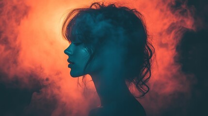 Woman's profile in smoky, red and blue light.