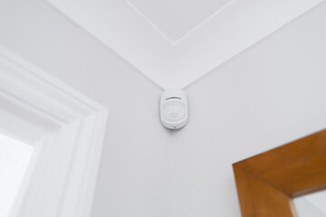 Newly installed wireless and battery operated new generation PIR alarm sensor in a downstairs room....