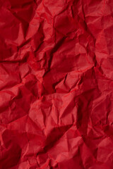 Close-up of red crumpled paper texture,Red paper backround. Red crumpled paper texture. Red crumpled paper texture. Red wrapping paper as Christmas background 