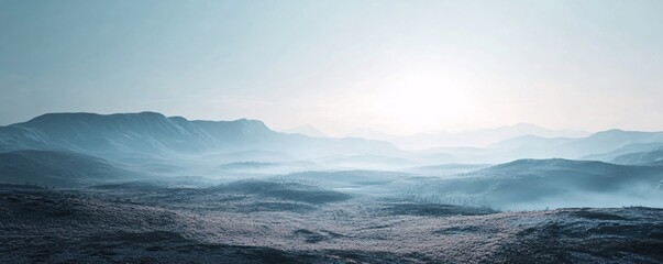 Obraz premium Sunlight illuminating misty mountains and valleys at sunrise