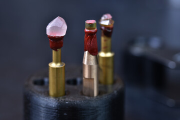 Standing metal doped with attached gemstones amethyst and peridot