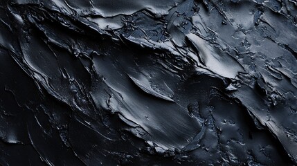 Black relief paste creating a dramatic textured background