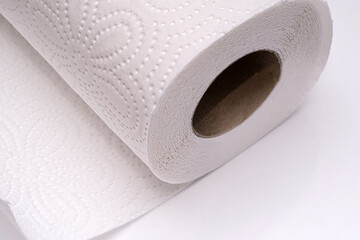 A close-up of a roll of white paper towels. This image emphasizes the practicality and perfect for cleaning and kitchen themes.