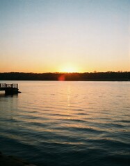 Tranquil Sunset Over Calm Water: A Serene Landscape Photography