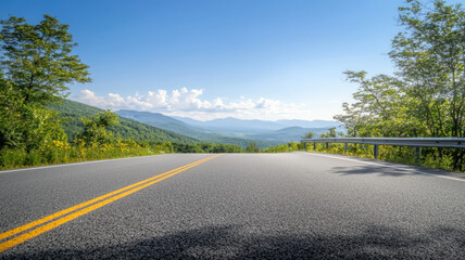 Fototapeta premium scenic view of highway merging with New England road, surrounded by lush greenery and mountains. bright sky enhances tranquil atmosphere