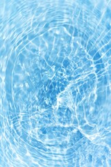 Bluewater waves on the surface ripples blurred. Defocus blurred transparent blue colored clear calm water surface texture with splash and bubbles. Water waves with shining pattern texture background.