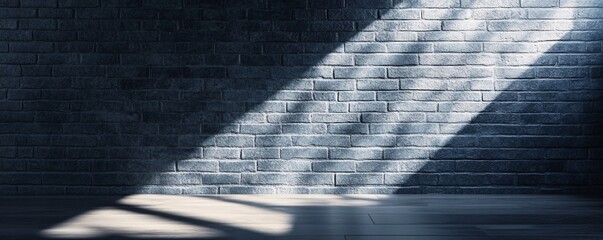 Empty room with sunlight shining through window on brick wall and wooden floor